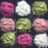 Various colorful superfood powders on dark background. Healthy food supplements, detox concept. Top view